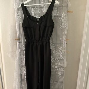 Luna  Jumpsuit NWOT. Pockets in the front and Jeanie legs.